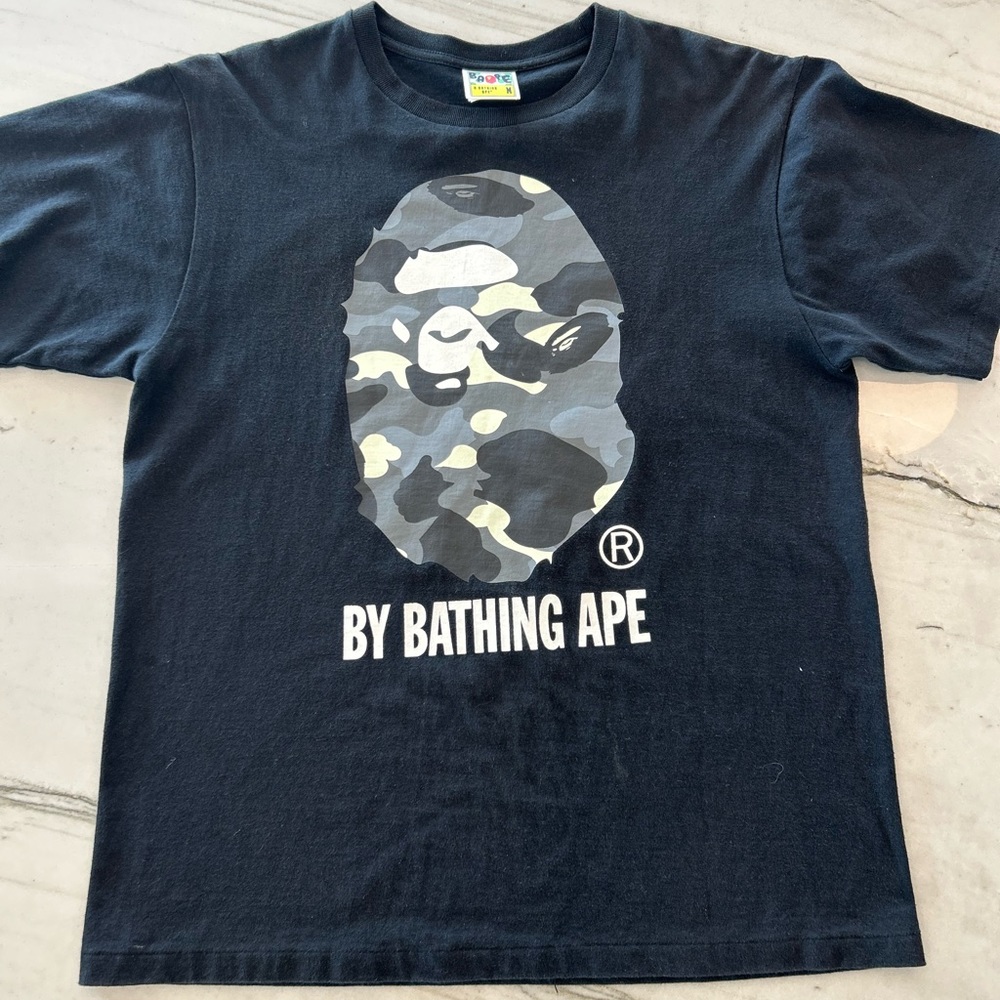 Bape shirt size medium took really good care super good quality and very nice !!